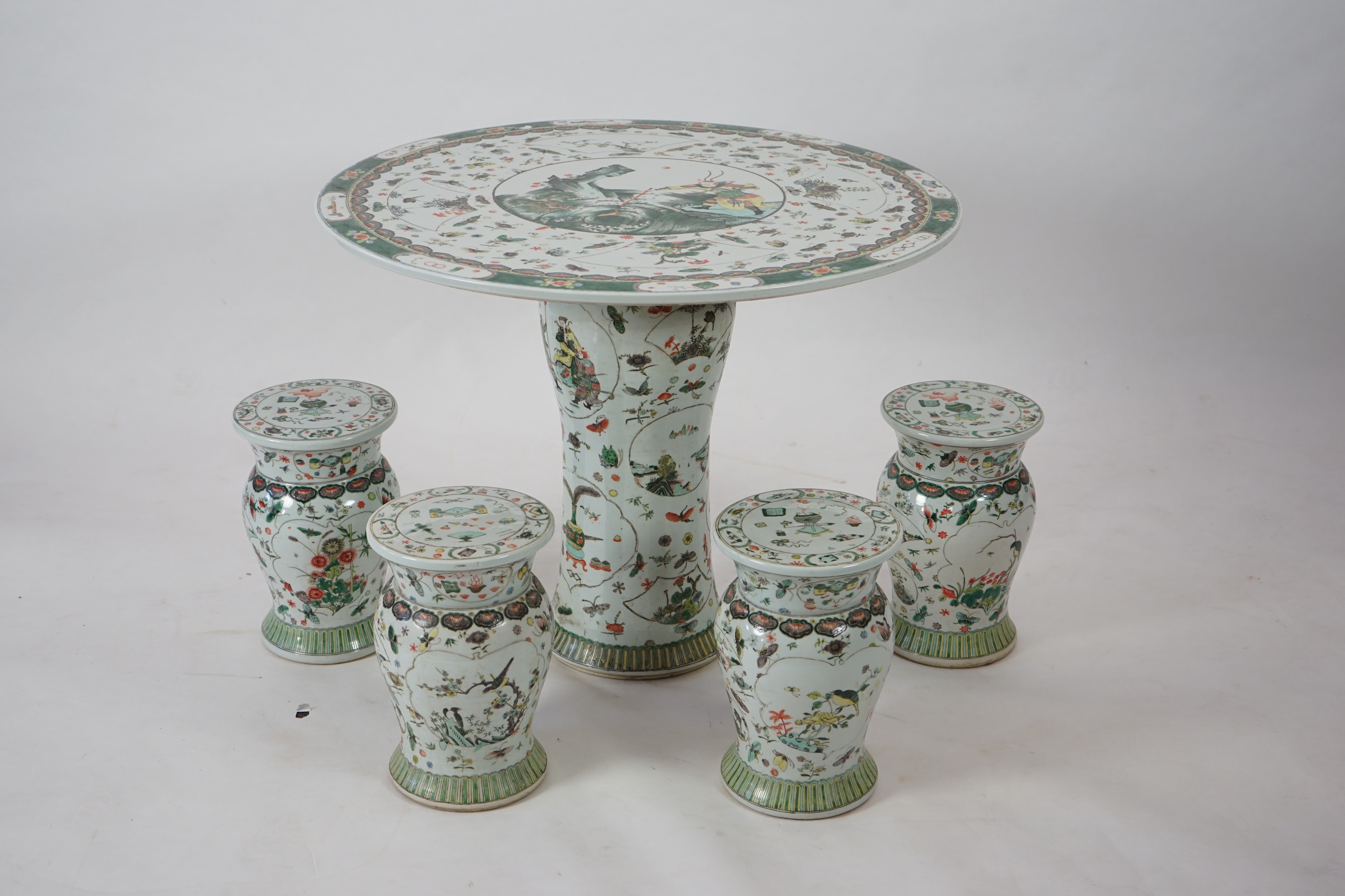 CORRECTION LATE 20th century, A large Chinese famille verte pedestal table and four matching stools